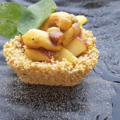 A picture of Rajgira jaggery tart with caramelized apple and nuts.