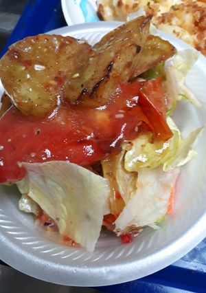 A picture of Tomato Sauté with Salad.