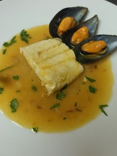 Una foto de Merluza a la marinera