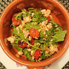 A picture of Slow roasted tomato, rocket and feta salad.