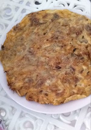 Una foto de Tortilla de alcachofas con cebolla