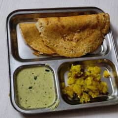 A picture of Yellow mung bean dosa.
