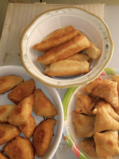A picture of Samosa, meat pie and meat roll.