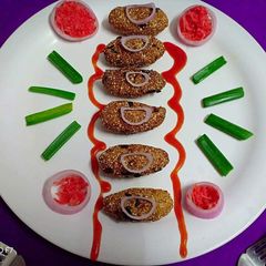 A picture of Bajra chop with carrot and spring onions flavor.