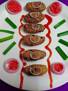 A picture of Bajra chop with carrot and spring onions flavor.