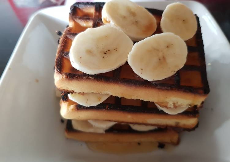 Toasted Waffles layered with Banana and Runny Honey