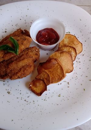 Una foto de Alitas rebozados con batatas chips