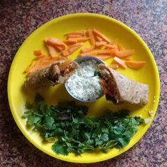 A picture of Paneer Egg wrap with veggies.
