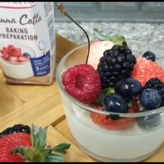 A picture of Panna cotta with Fresh berries.