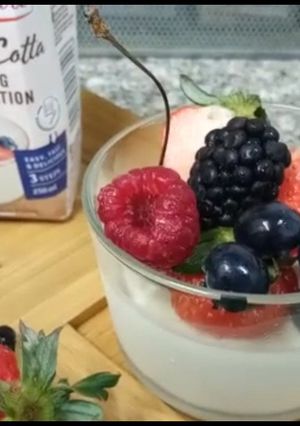 A picture of Panna cotta with Fresh berries.