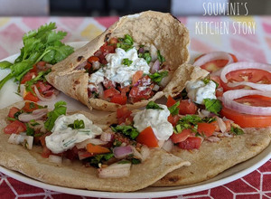 A picture of Pita bread with chicken mince filling, tomato salsa & yogurt dip.