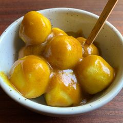 A picture of Fish Balls with Curry Sauce.