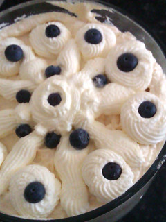 A picture of banana, blueberry and coconut trifle.