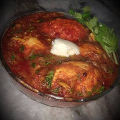 A picture of Egg Curry in Tomato Gravy.