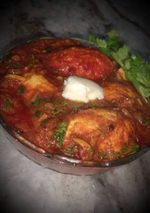 A picture of Egg Curry in Tomato Gravy.