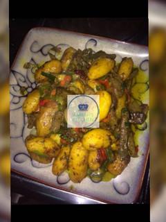 A picture of Beef and vegetables sauce with potatoes.