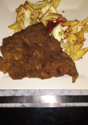 Una foto de Milanesa de carne con fritas