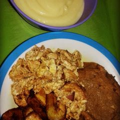 A picture of Moimoi, plantain and scrambled egg with pap.
