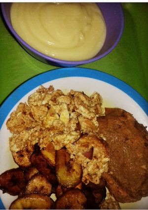 A picture of Moimoi, plantain and scrambled egg with pap.