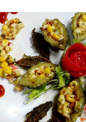A picture of Bittergourd corn cheesy boat.