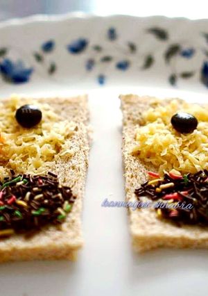 A picture of Open cheese chocolate sandwich.