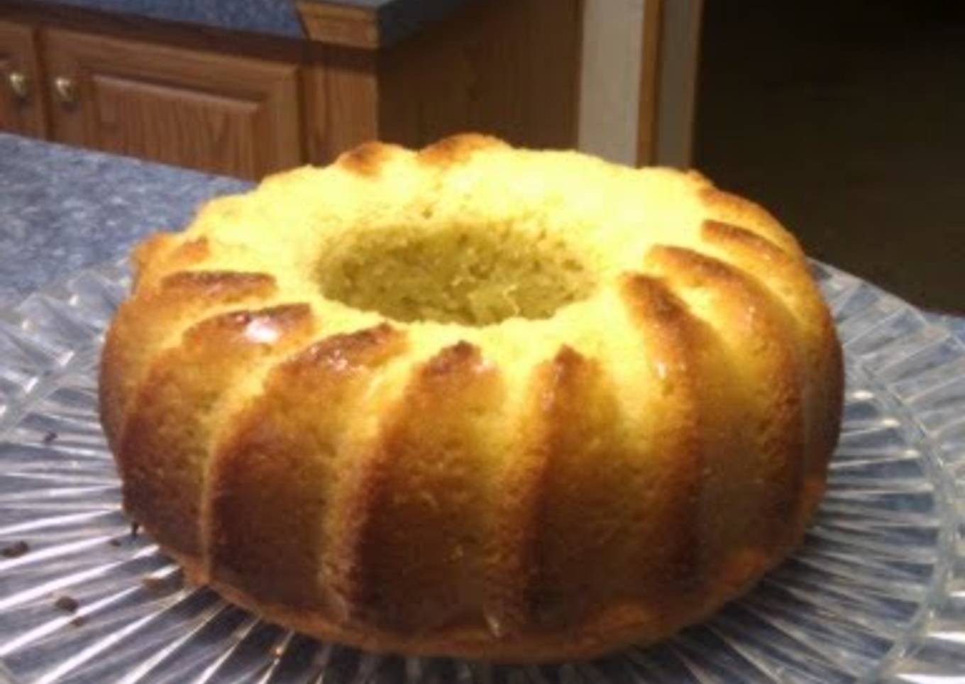 Homemade sponge cake with strawberries on the side.