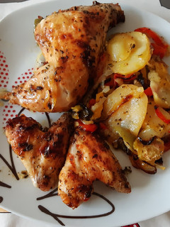 Una foto de Pollo asado a la naranja y compañía