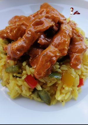 A picture of Nandos style Peri Chicken Strips and Spicy Rice.