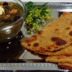 Sarson ka saag with makki ki roti A picture of Sarson ka saag with makki ki roti.