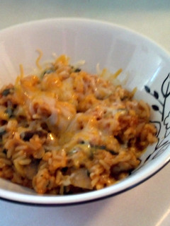 A picture of spinach and mushroom rice.