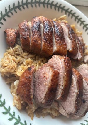 A picture of Crispy Duck Breast with Flavored Rice.
