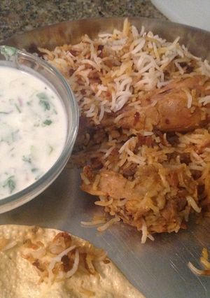 A picture of Chicken Dum Biryani with Raita.