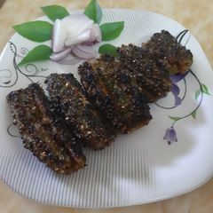A picture of Karela Tawa Fry Bitter Gourd Fry.