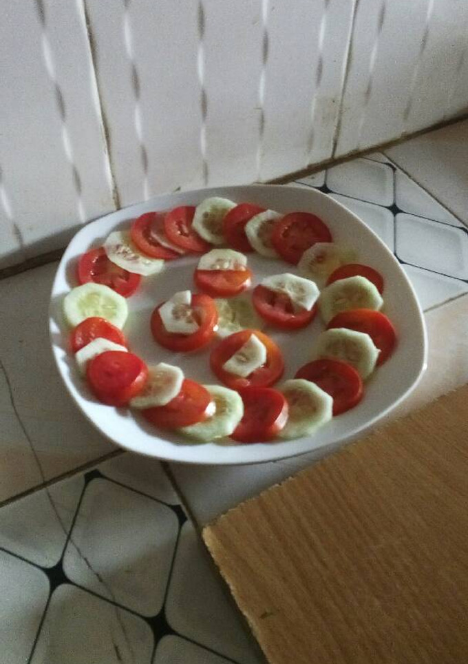 A picture of Cucumber tomato salad.