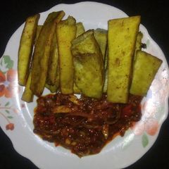 Spicy fried yam and smoked fish sauce A picture of Spicy fried yam and smoked fish sauce.