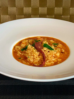 Una foto de Arroz caldoso de pulpo y langostinos