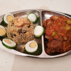 A picture of Fried Rice and peper chicken.