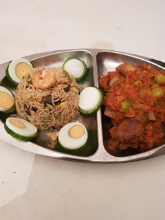 A picture of Fried Rice and peper chicken.