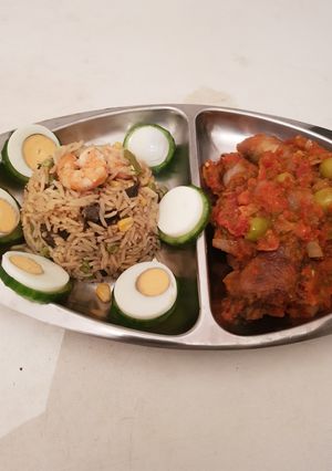 A picture of Fried Rice and peper chicken.