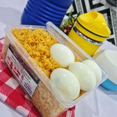A picture of Kids Jollof Rice and Boiled Egg.