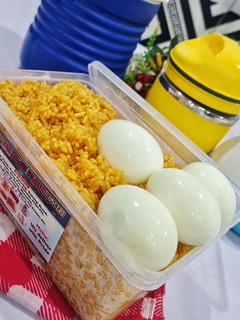 A picture of Kids Jollof Rice and Boiled Egg.