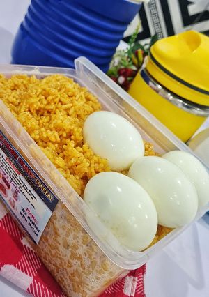 A picture of Kids Jollof Rice and Boiled Egg.
