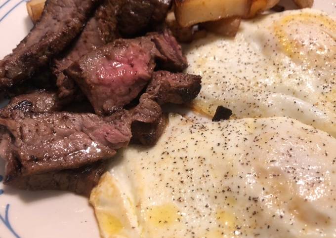Steak and eggs with a side of home fries
