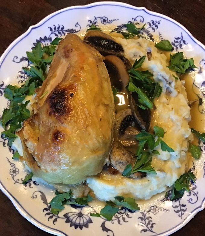 A picture of California Farm Whole Chicken in Mushroom Sauce with Mashed Potatoes.