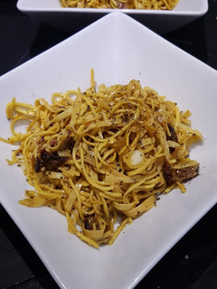 Una foto de Pasta con tomates secos y jamón