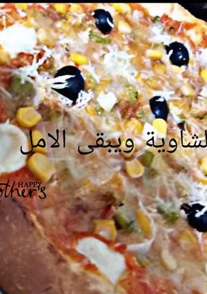صورة لوصفة بيتزا على ضمانتي بنة ولا اروع