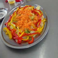 A picture of Lettuce, carrot and yellow, red pepper salad.
