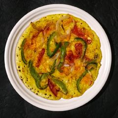 A picture of Green chutney peri peri veg uttapum.