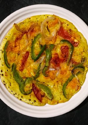 A picture of Green chutney peri peri veg uttapum.