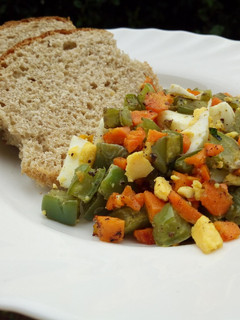 A picture of Nopal cactus salad with boiled egg..and whole wheat bread.